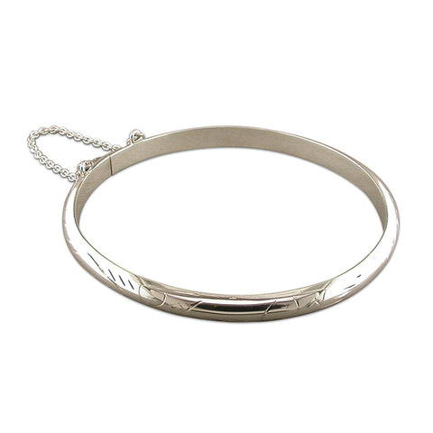 Silver engraved hinged bangle complete with presentation box