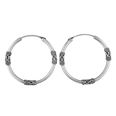 Silver hinged wire hoop earrings complete with presentation box