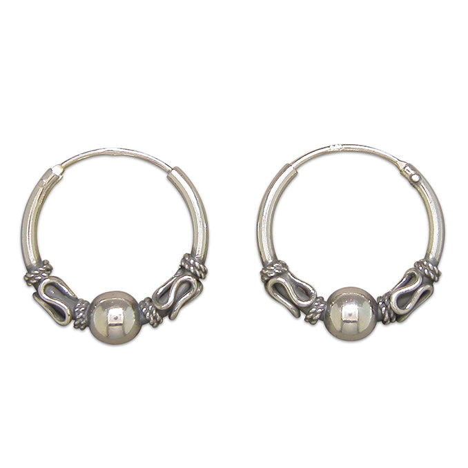 Silver hinged wire hoop earrings complete with presentation box
