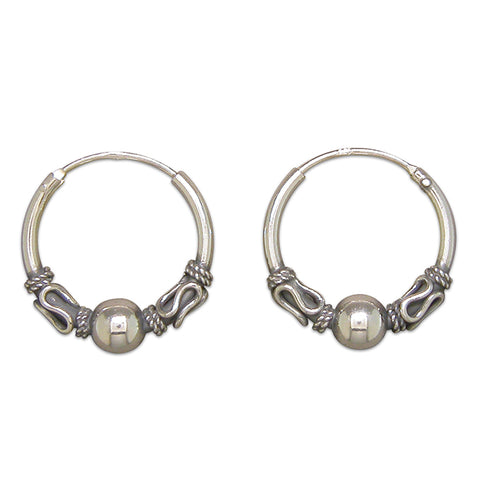 Silver hinged wire hoop earrings complete with presentation box
