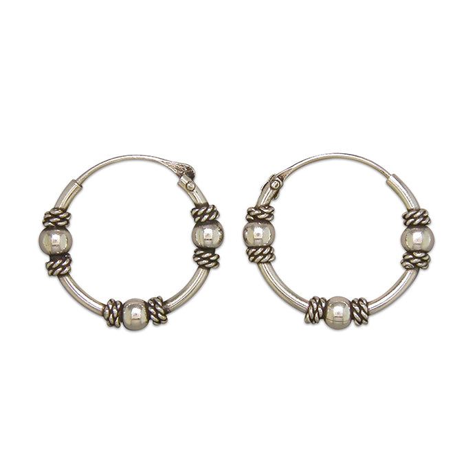 Silver hinged wire hoop earrings complete with presentation box