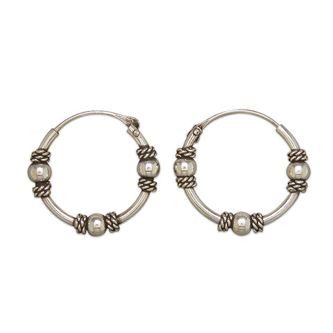Silver hinged wire hoop earrings complete with presentation box