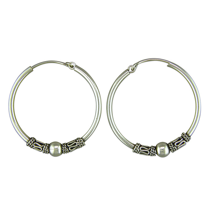 Silver hinged wire hoop earrings complete with presentation box