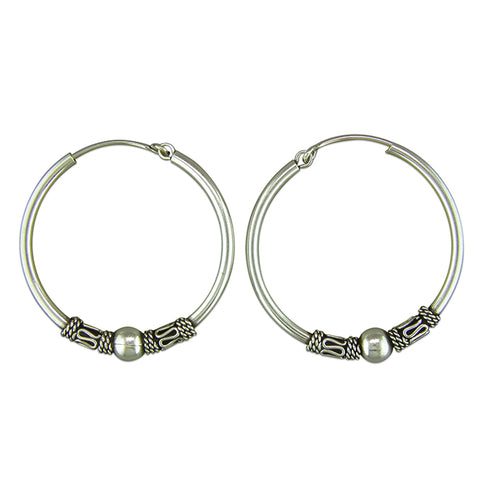 Silver hinged wire hoop earrings complete with presentation box