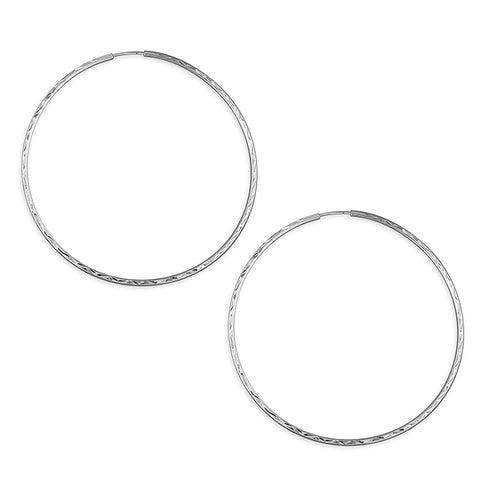 Silver hinged wire hoop earrings complete with presentation box