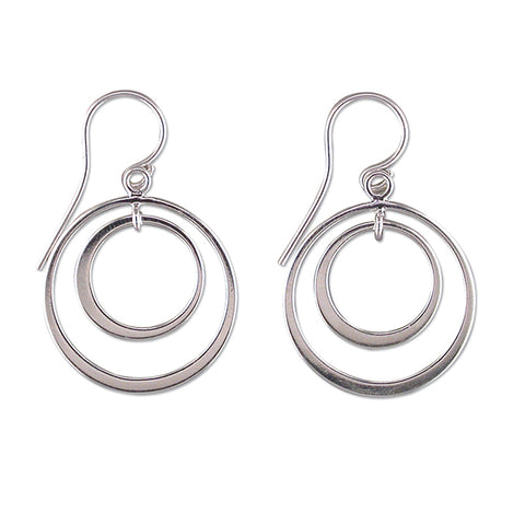 Silver circle cut out drop earrings complete with presentation box
